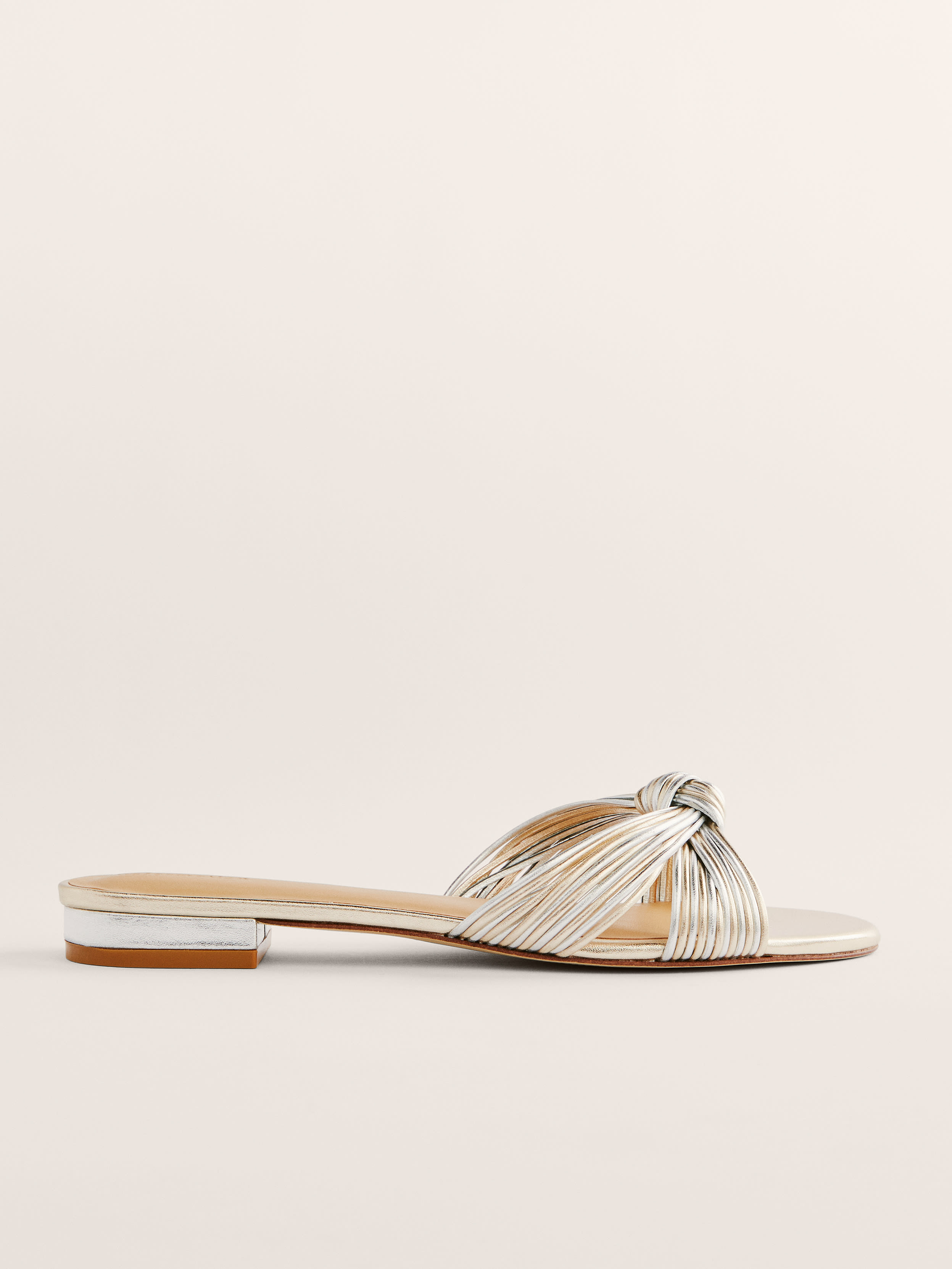 Reformation Peridot Mignon Knot Flat Sandal In Gold / Silver