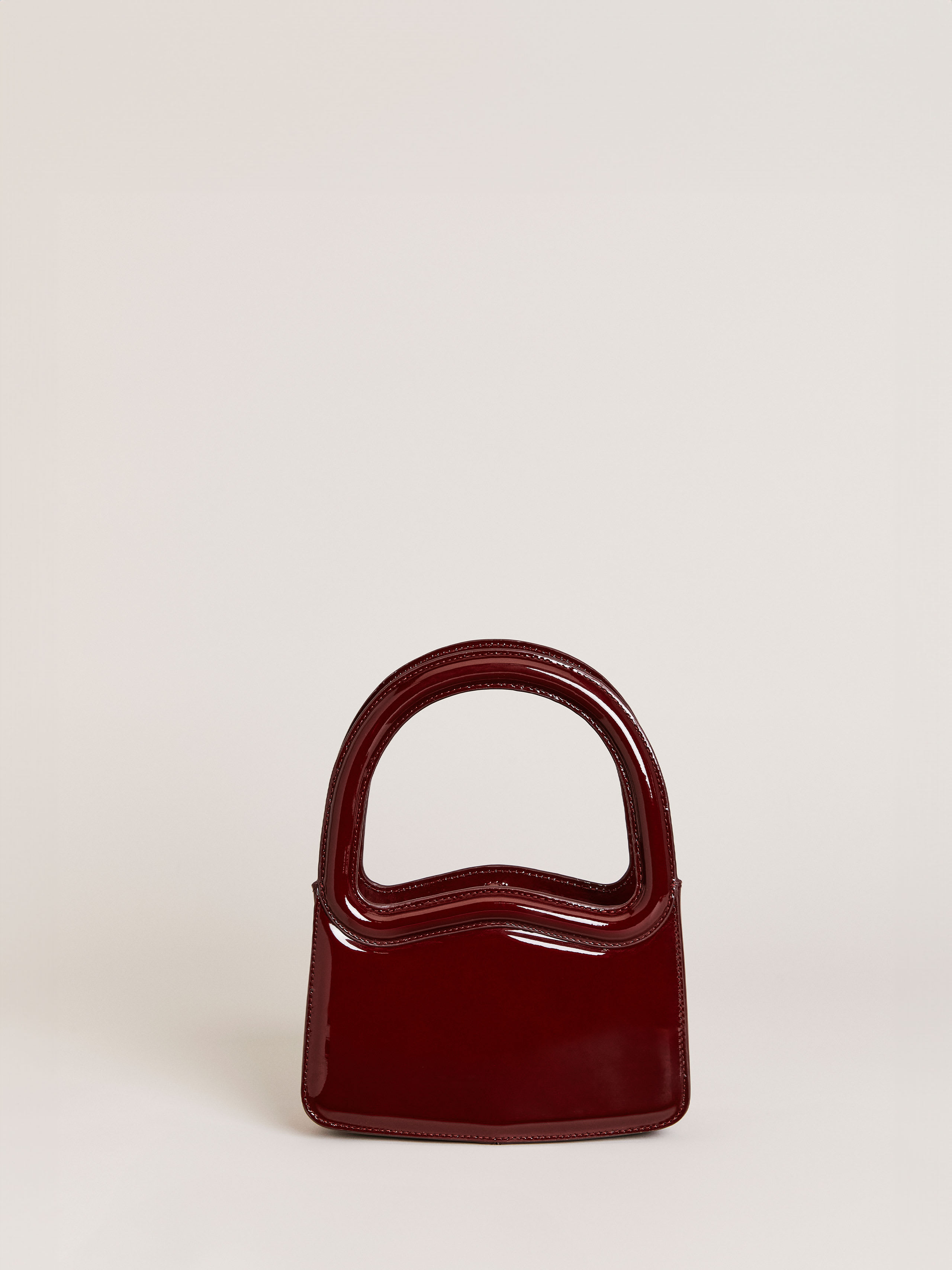 Shop Reformation Mini Monica Frame Handle In Ruby Patent