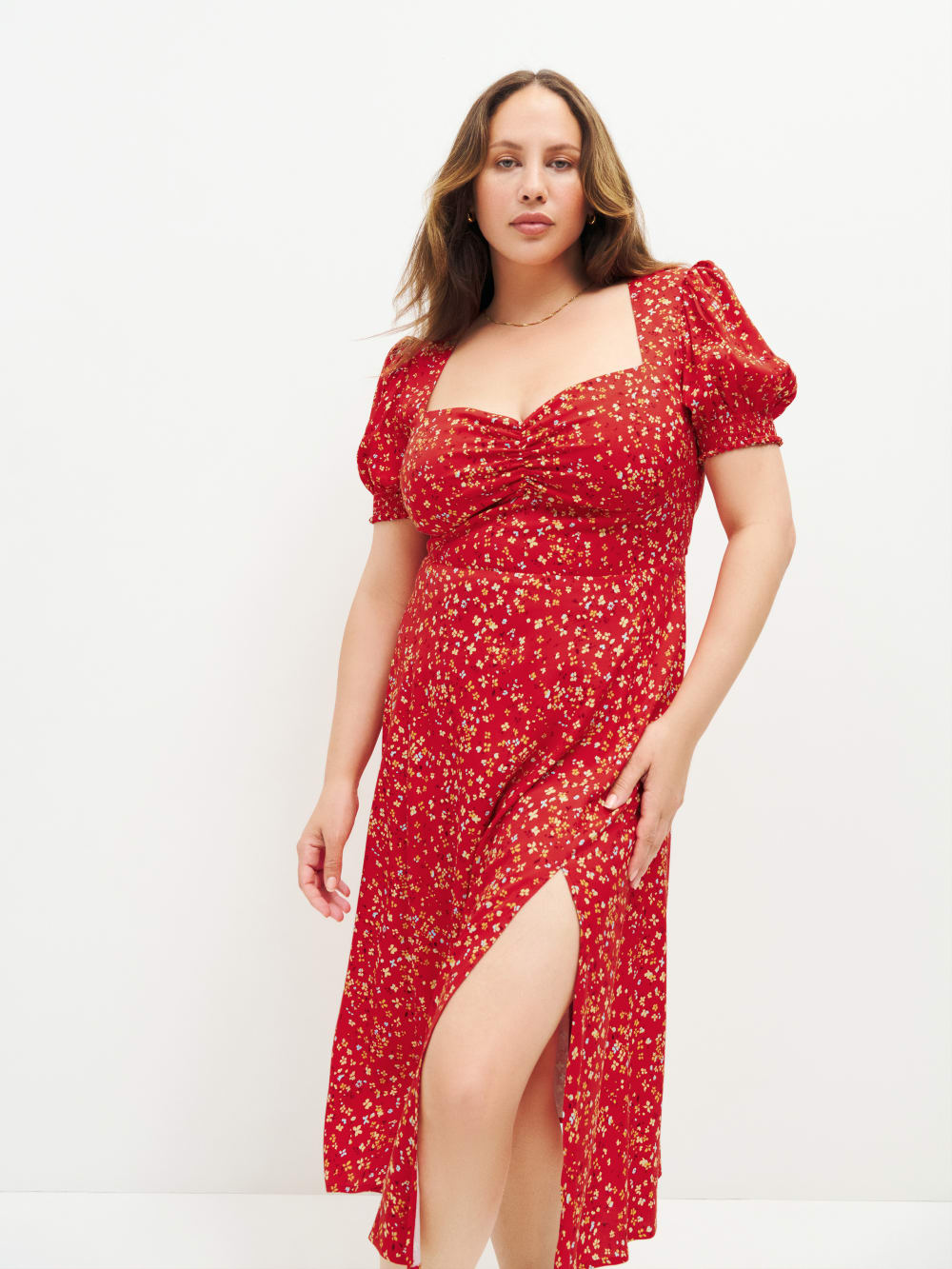 Reformation red floral lacey midi dress. This dress has Back smocking, sweetheart neckline with ruching detail, and side slit with a Back zipper. 