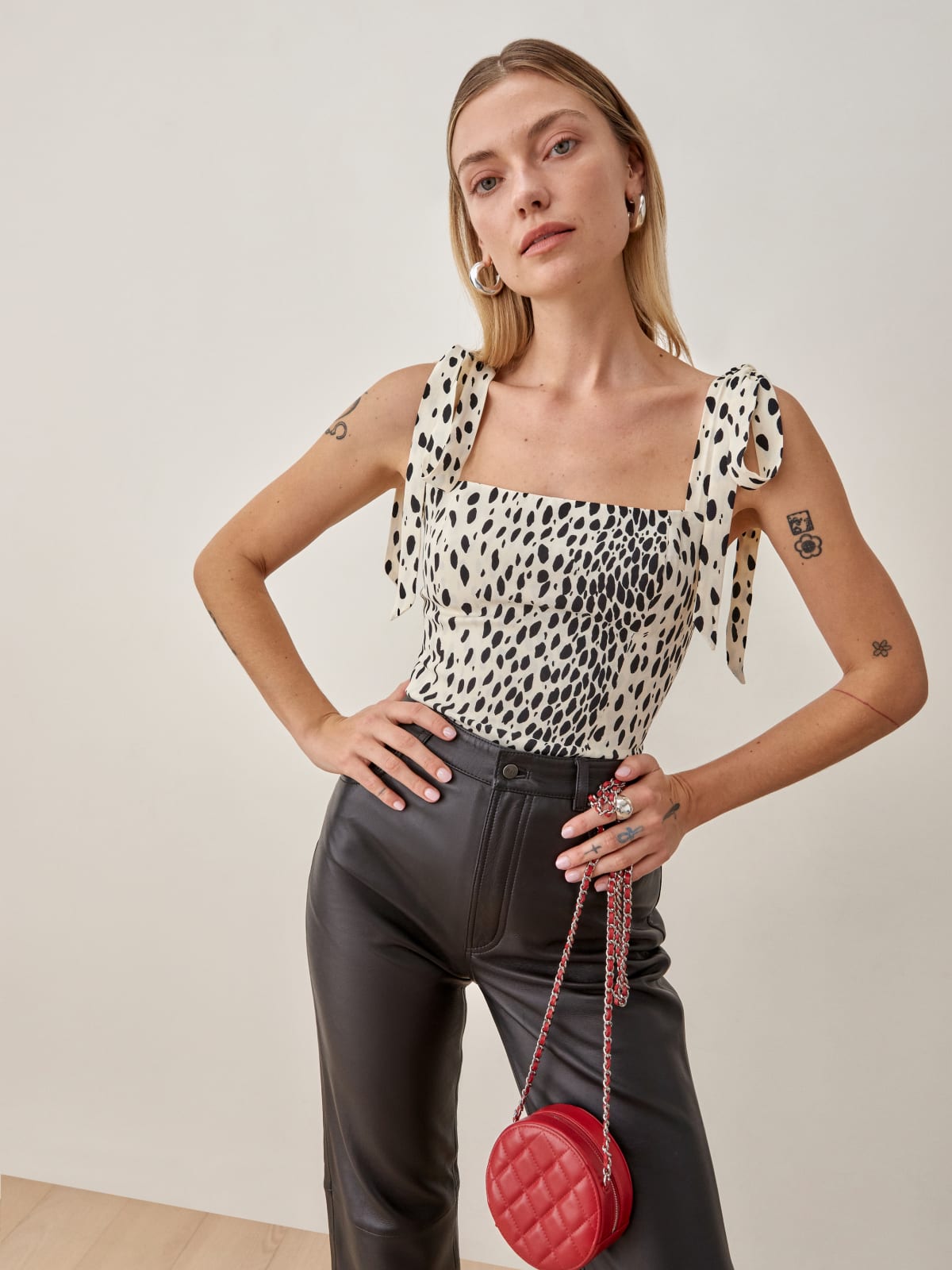 Reformation Ellora Cheetah print top. This top has a Center back zipper with a Fitted bodice and Hip length silhouette.It has a Smocked back bodice and Straight neckline with tie straps. 