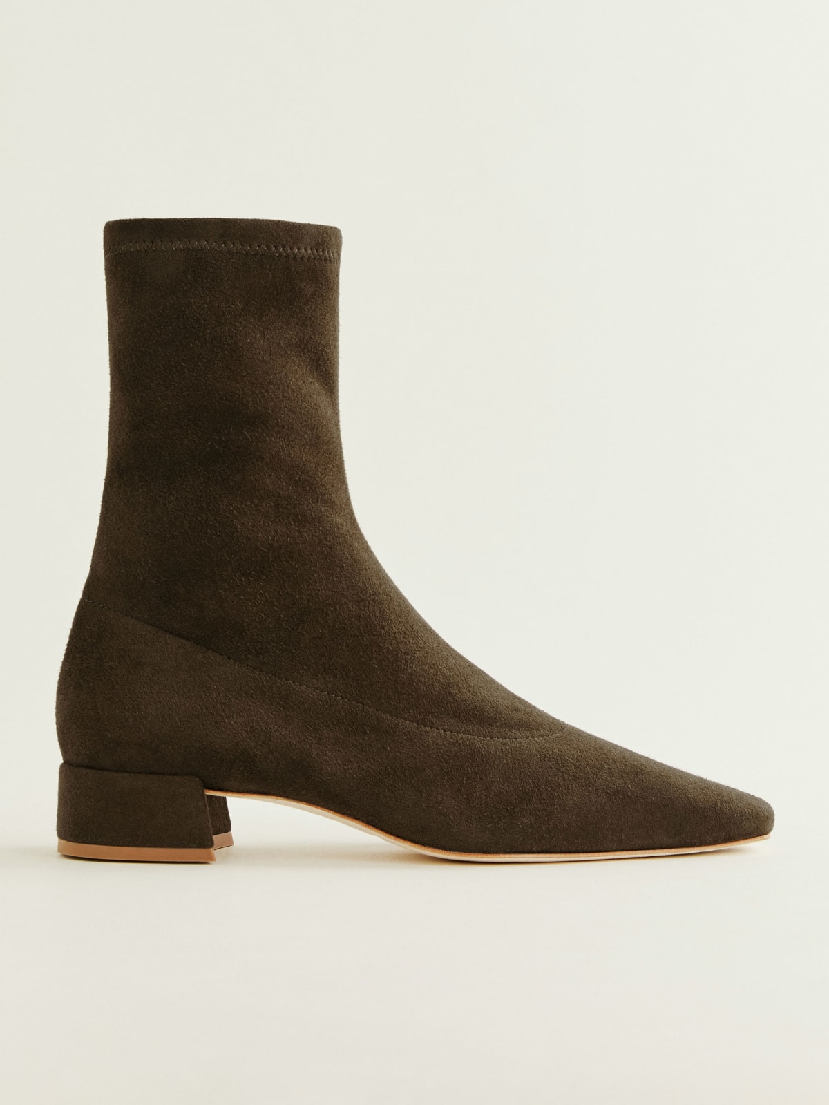 Reformation suede sock boot with low heel in brown suede. 