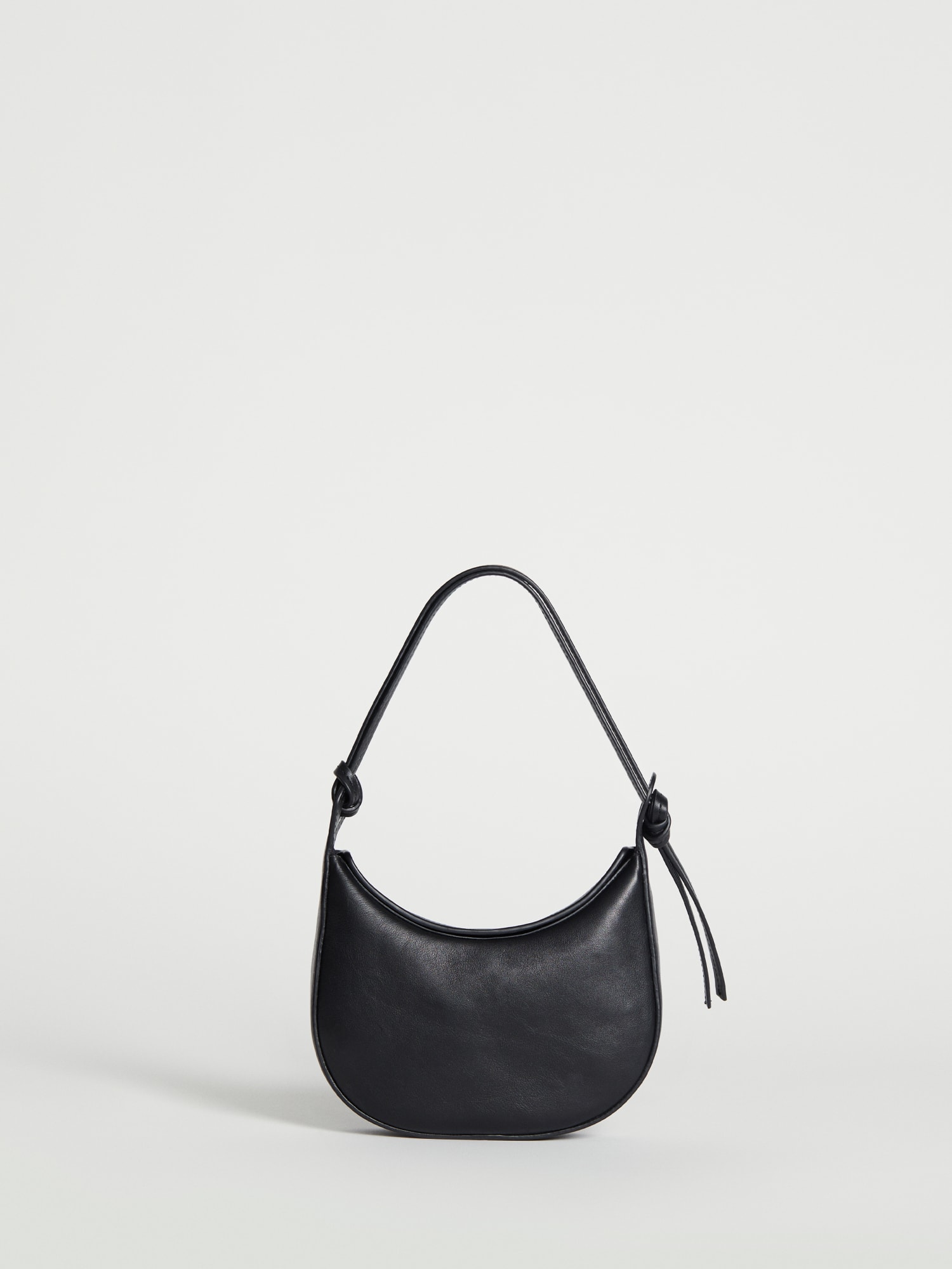 The Row, 90's black leather bag