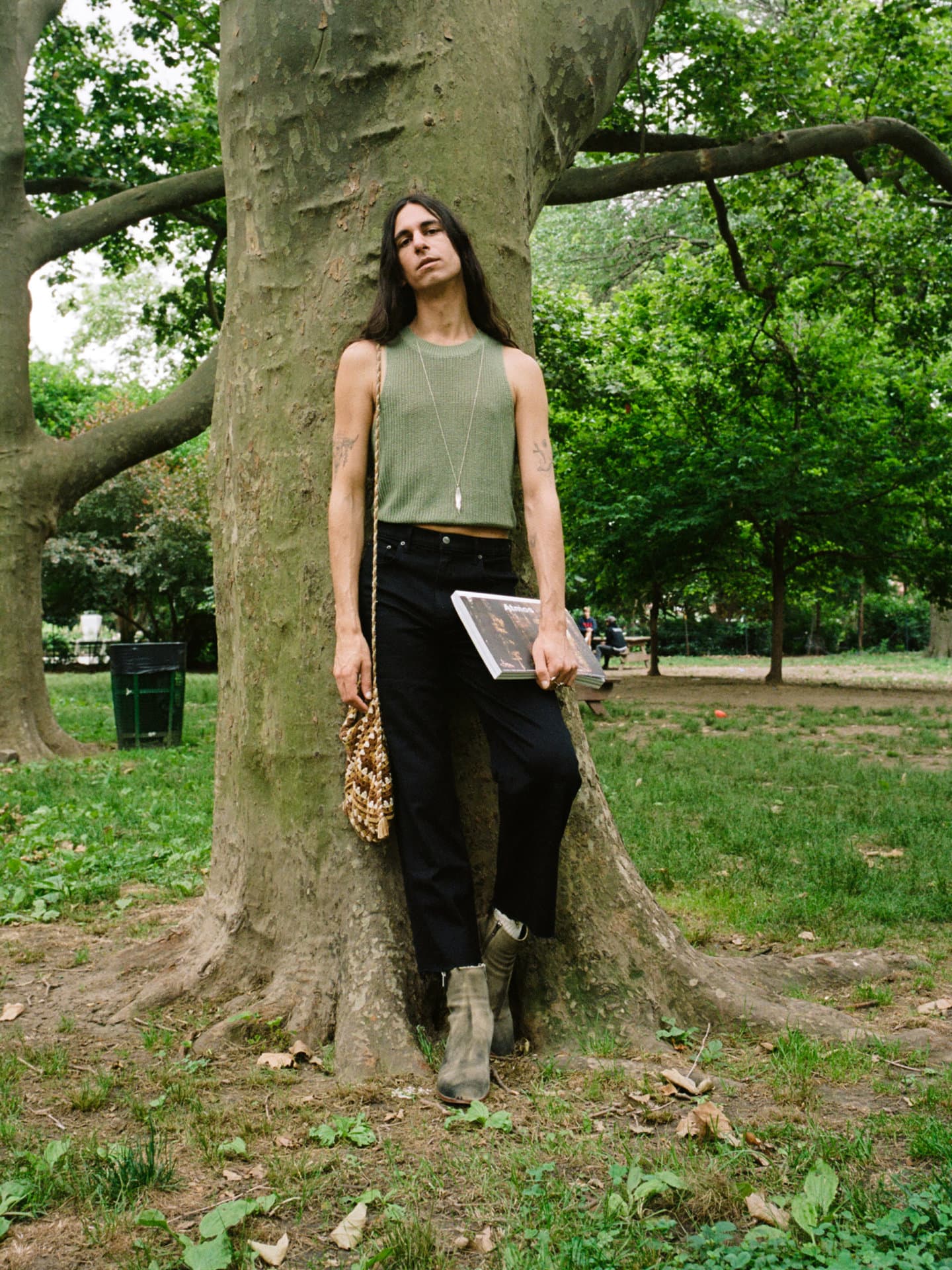 Willow is wearing the Lilac Top in ARTICHOKE and the Emma High Rise Jeans in BLACK.